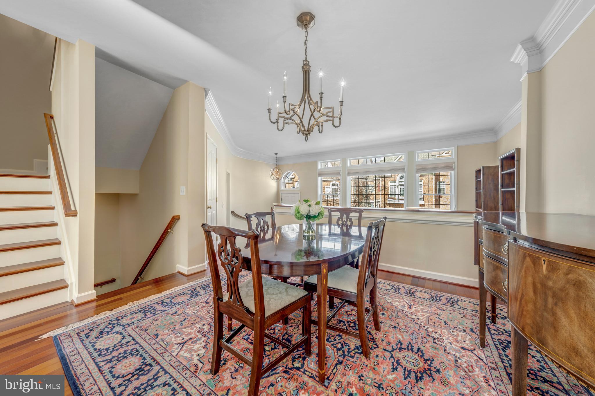 1916 Logan Manor Drive Reston, VA 20190 - Photo 12 of 56 a view of a dining room with furniture and a chandelier