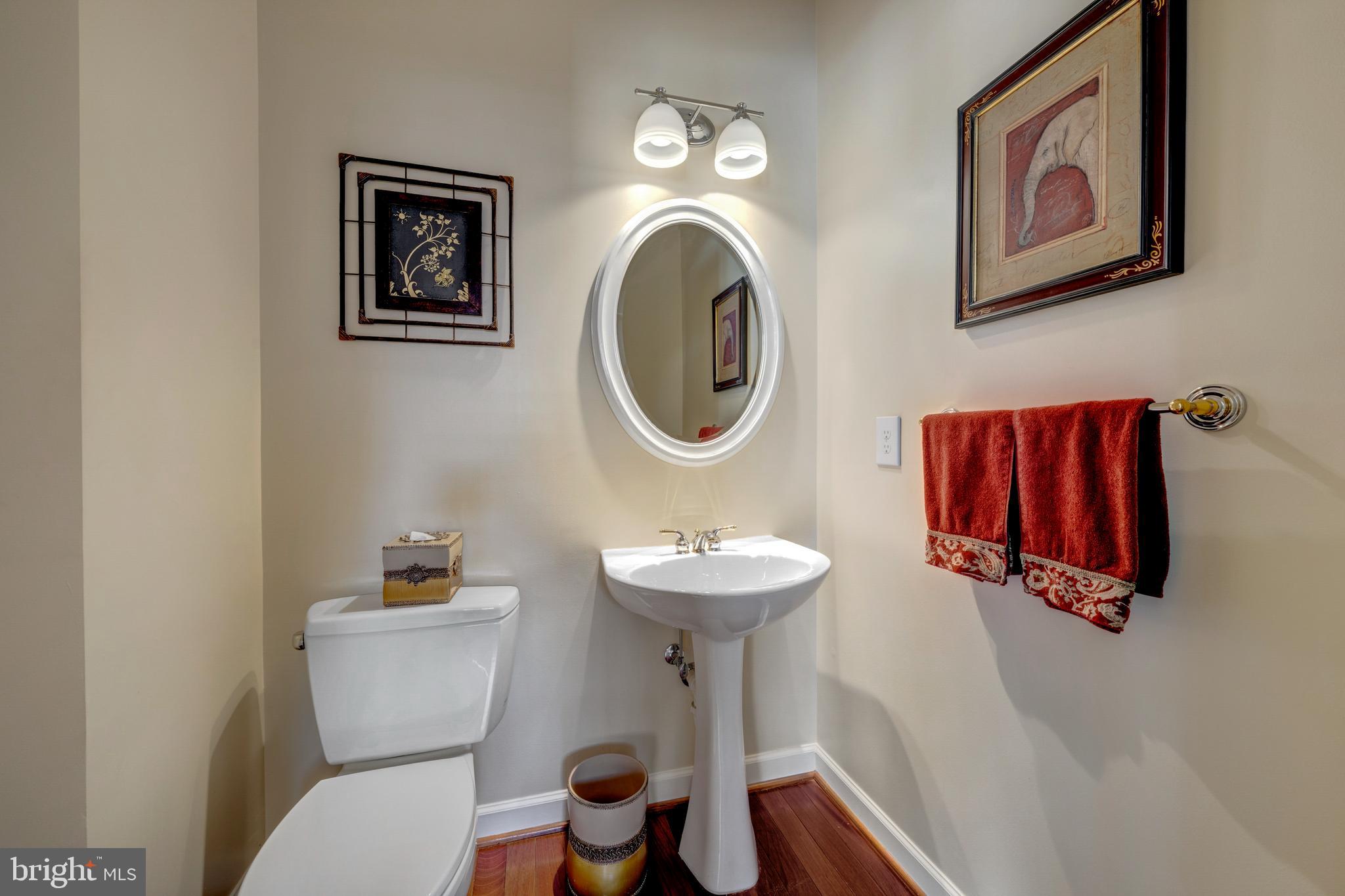 1916 Logan Manor Drive Reston, VA 20190 - Photo 13 of 56 a bathroom with a toilet sink and mirror