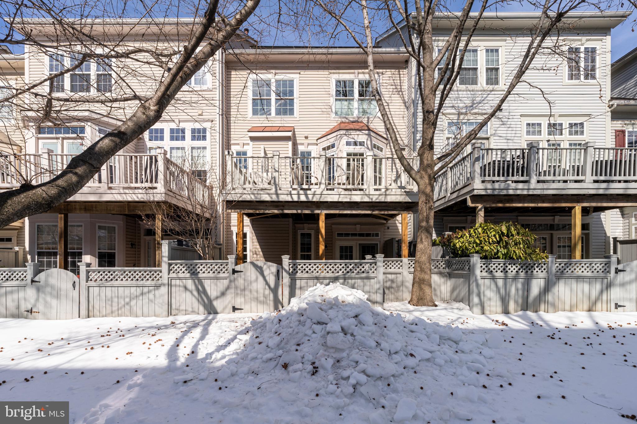1916 Logan Manor Drive Reston, VA 20190 - Photo 14 of 56 a view of a building with a bench and chairs