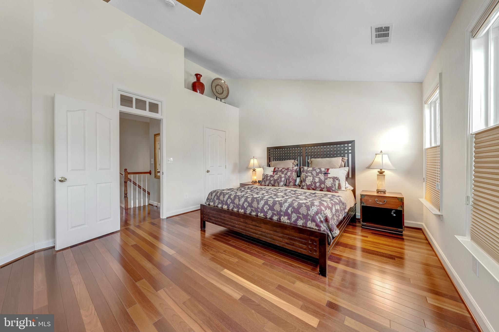 1916 Logan Manor Drive Reston, VA 20190 - Photo 18 of 56 a bedroom with a bed and wooden floor