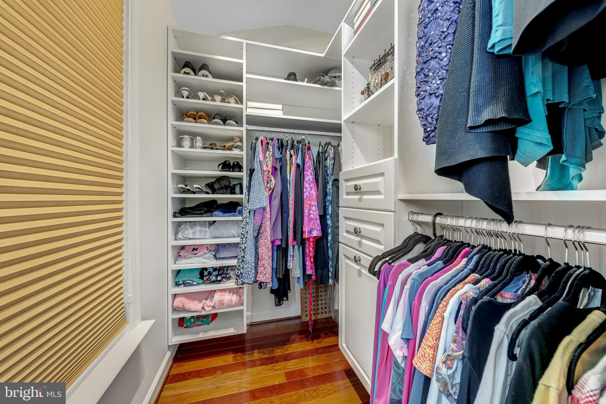 1916 Logan Manor Drive Reston, VA 20190 - Photo 19 of 56 a view of walk in closet with clothes and shoes