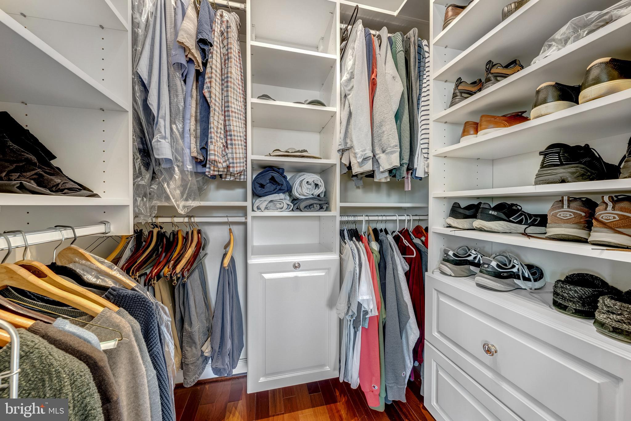 1916 Logan Manor Drive Reston, VA 20190 - Photo 22 of 56 a view of walk in closet with clothes and shoes