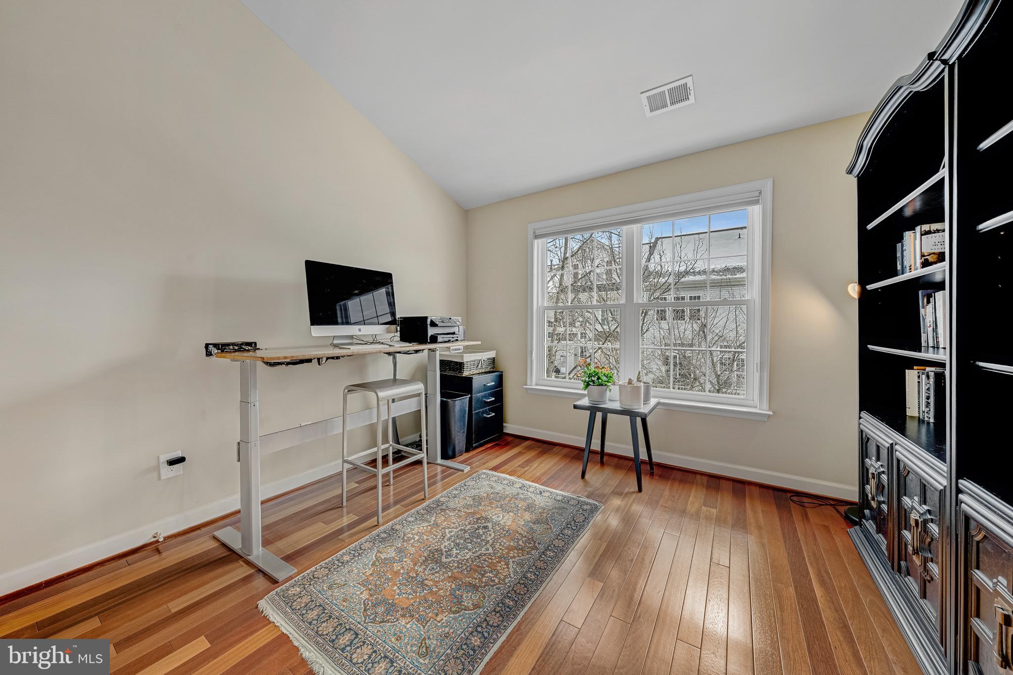 1916 Logan Manor Drive Reston, VA 20190 - Photo 25 of 56 a living room with furniture flat screen tv and a window