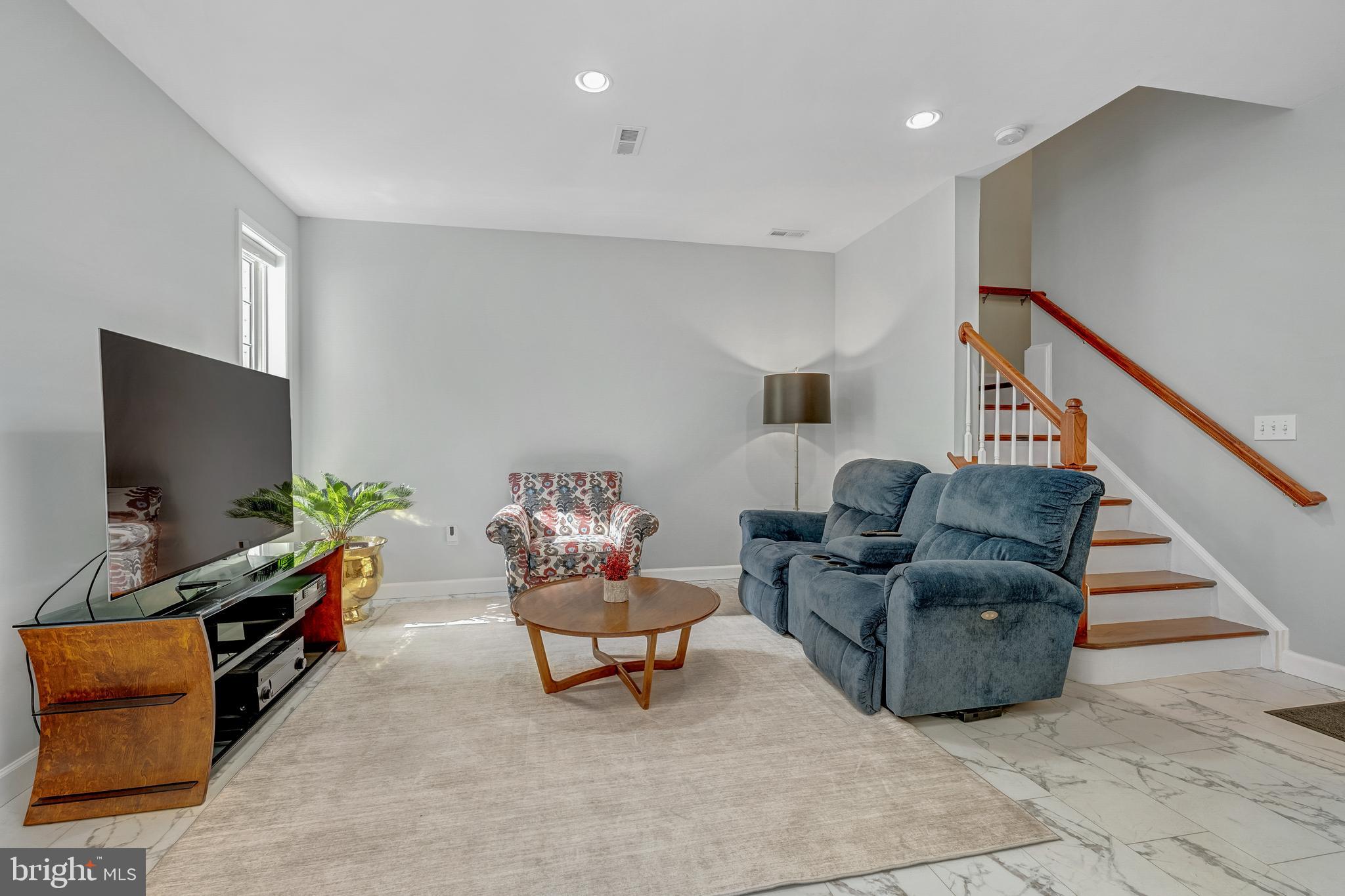 1916 Logan Manor Drive Reston, VA 20190 - Photo 28 of 56 a living room with furniture and a flat screen tv