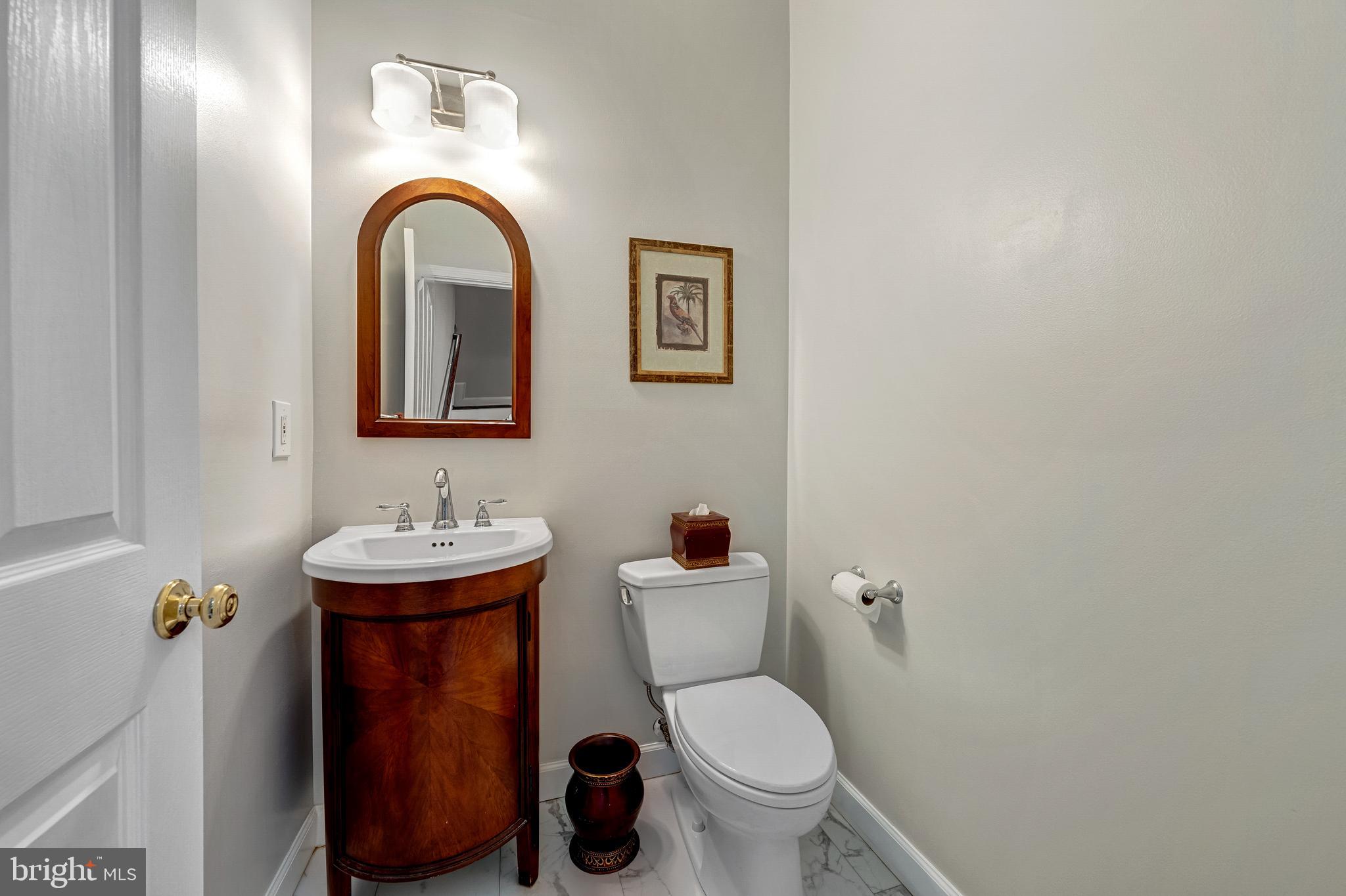1916 Logan Manor Drive Reston, VA 20190 - Photo 30 of 56 a bathroom with a toilet sink and mirror