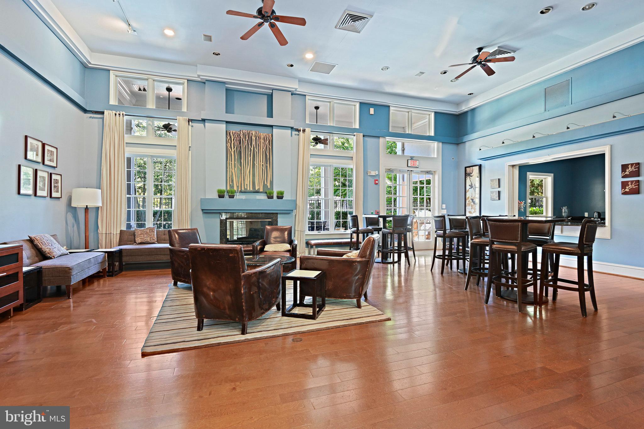 1916 Logan Manor Drive Reston, VA 20190 - Photo 49 of 56 a living room with furniture large window and wooden floor
