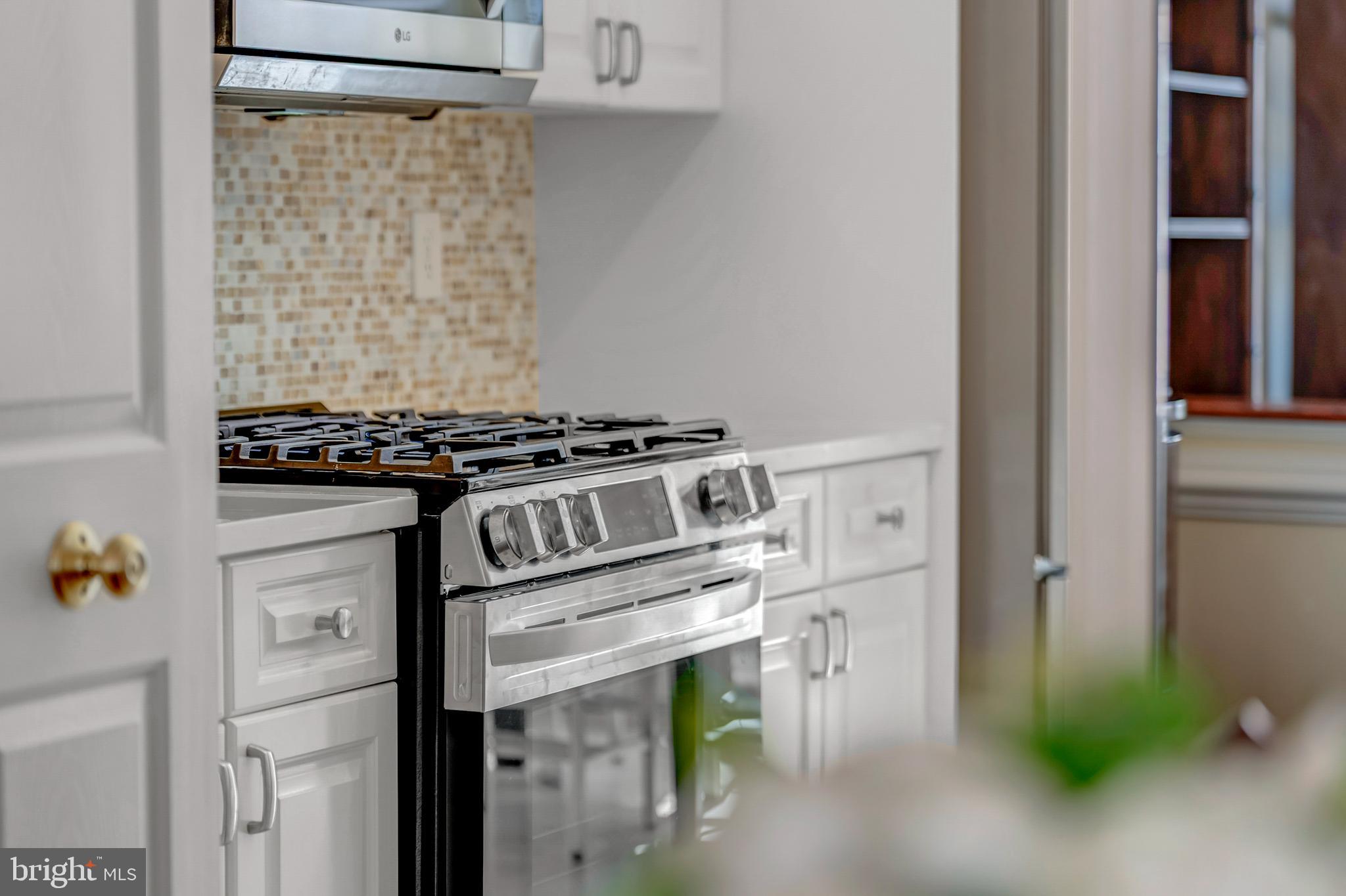 1916 Logan Manor Drive Reston, VA 20190 - Photo 8 of 56 a close view of a utility room with washer and dryer