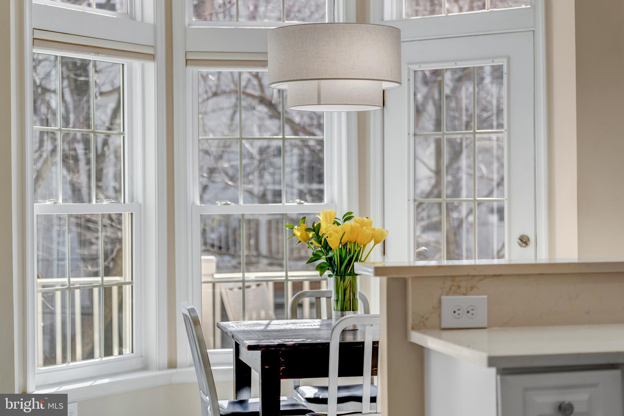1916 Logan Manor Drive Reston, VA 20190 - Photo 9 of 56 a view of a dining room with furniture and a window
