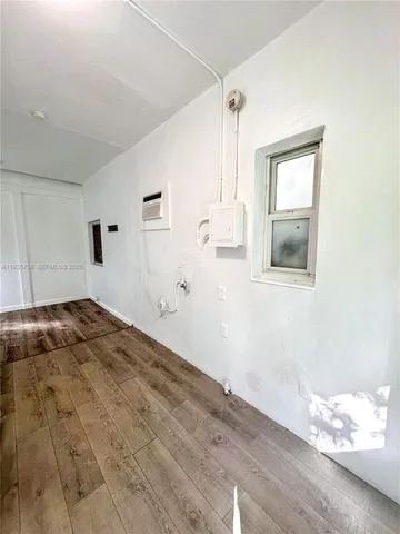 a bedroom with bed and window