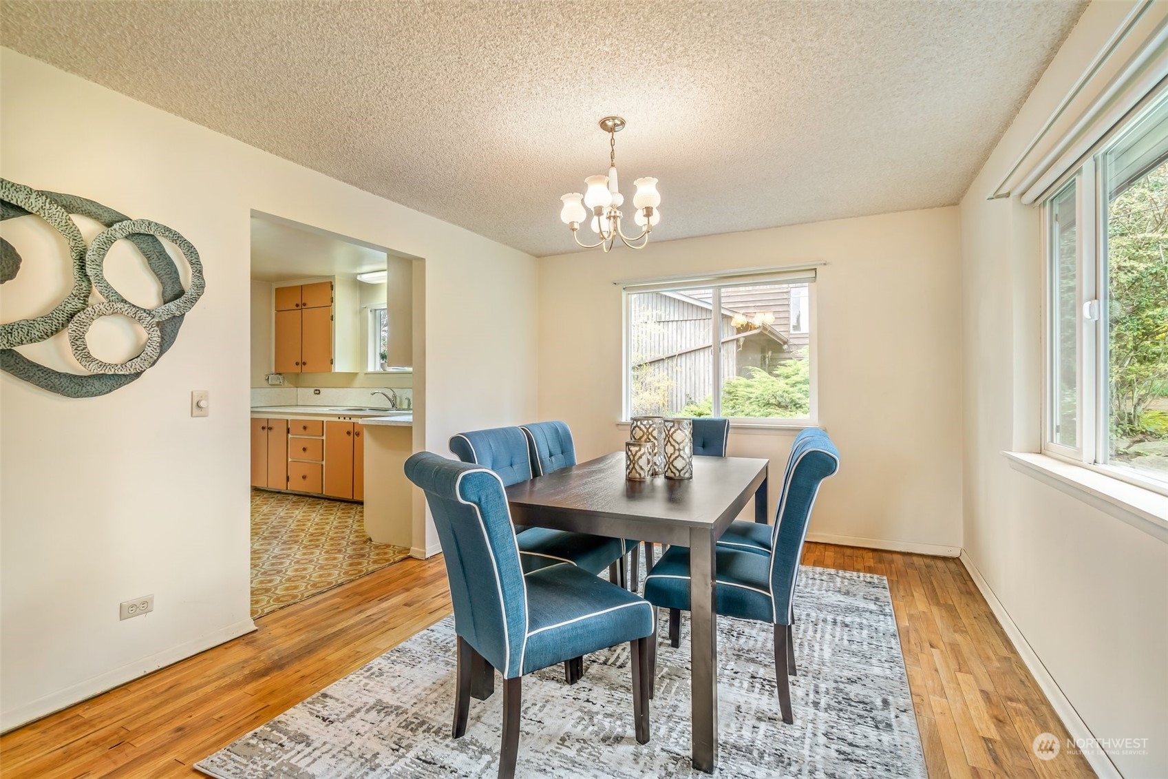 24324 7th Avenue West Bothell, WA 98021 - Photo 12 of 40 a view of a dining room with furniture window and wooden floor
