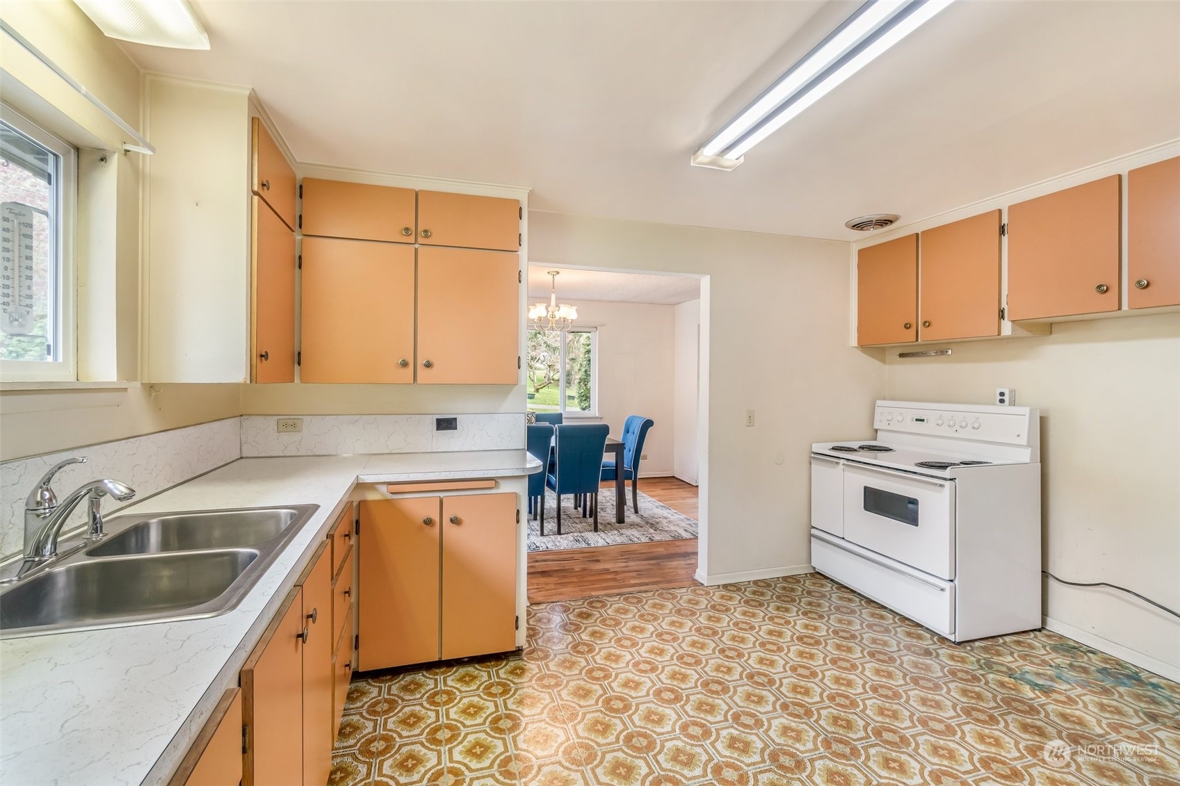 24324 7th Avenue West Bothell, WA 98021 - Photo 13 of 40 a kitchen with a stove a sink and a refrigerator
