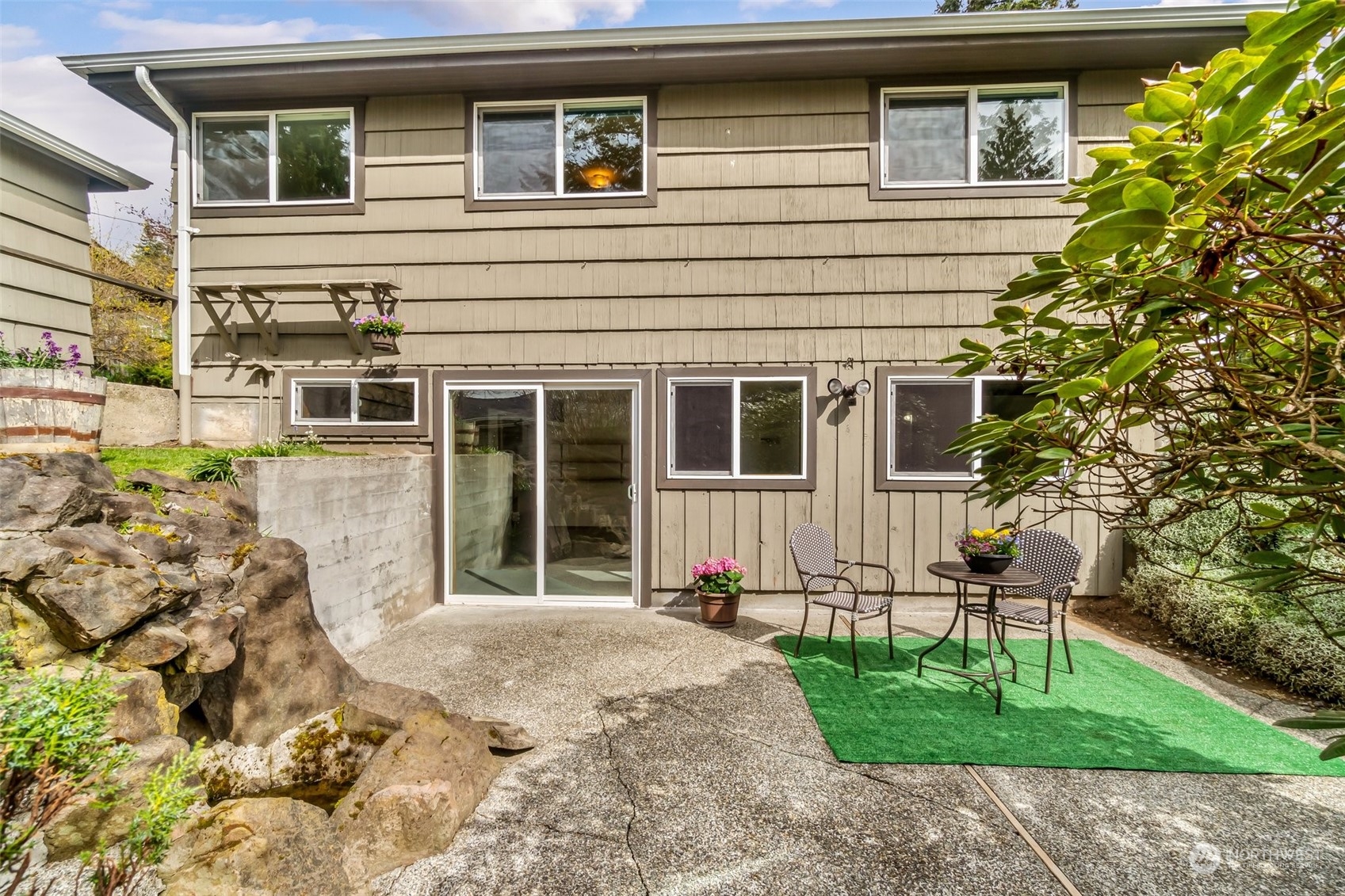 24324 7th Avenue West Bothell, WA 98021 - Photo 25 of 40 a view of a house with a yard and sitting space