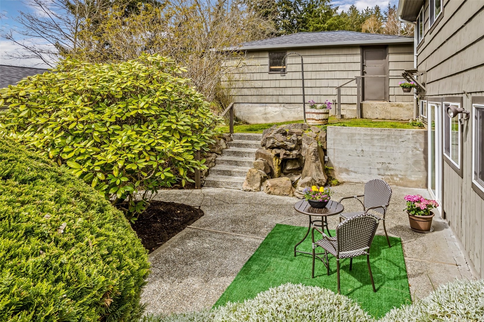 24324 7th Avenue West Bothell, WA 98021 - Photo 26 of 40 a view of a chairs and table in backyard