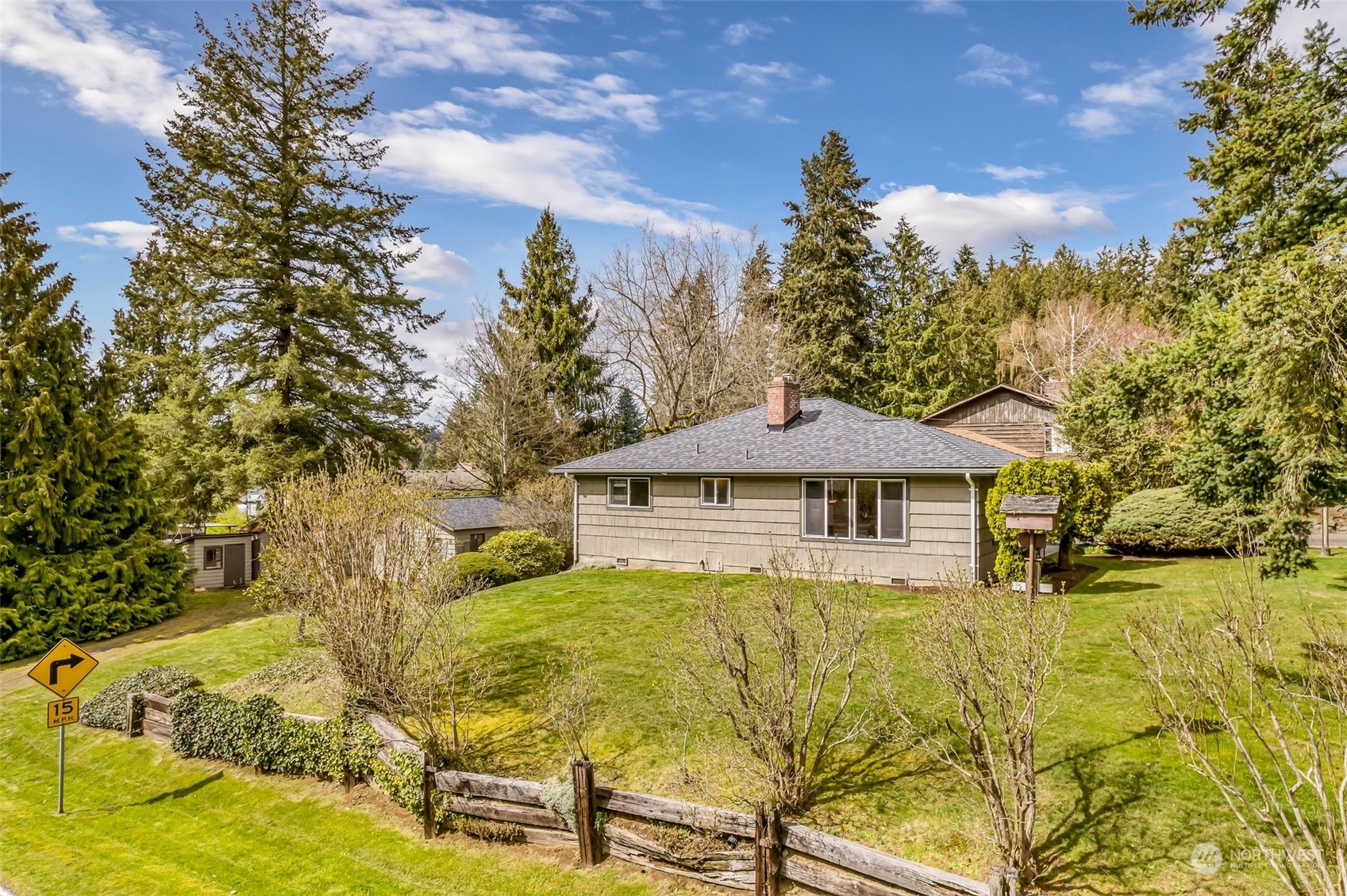 24324 7th Avenue West Bothell, WA 98021 - Photo 28 of 40 a front view of a house with a yard and trees
