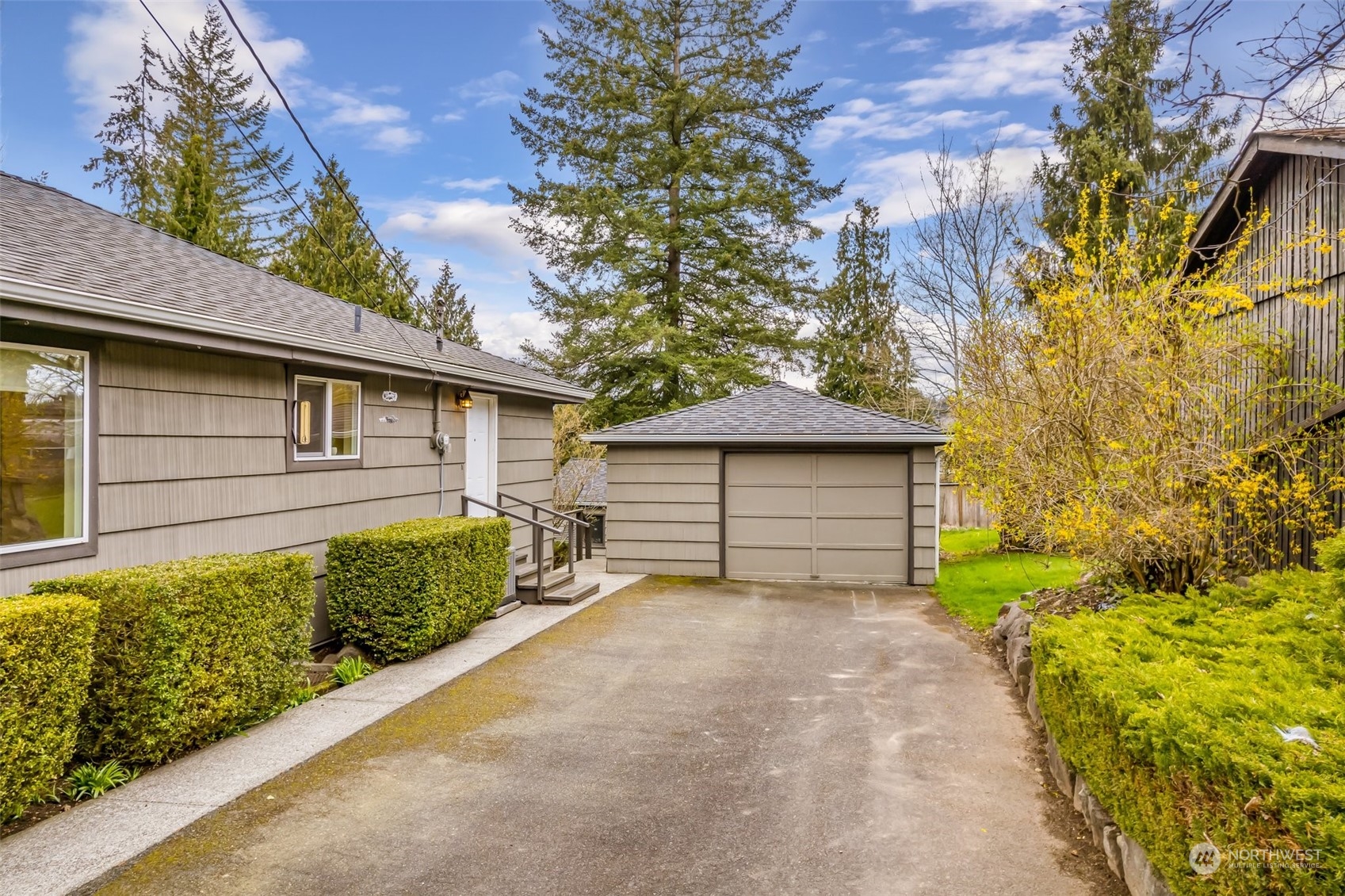 24324 7th Avenue West Bothell, WA 98021 - Photo 30 of 40 a front view of a house with a yard and garage