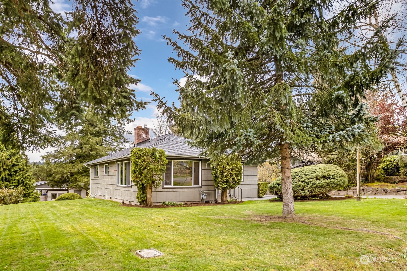 24324 7th Avenue West Bothell, WA 98021 - Photo 4 of 40 a front view of a house with a garden