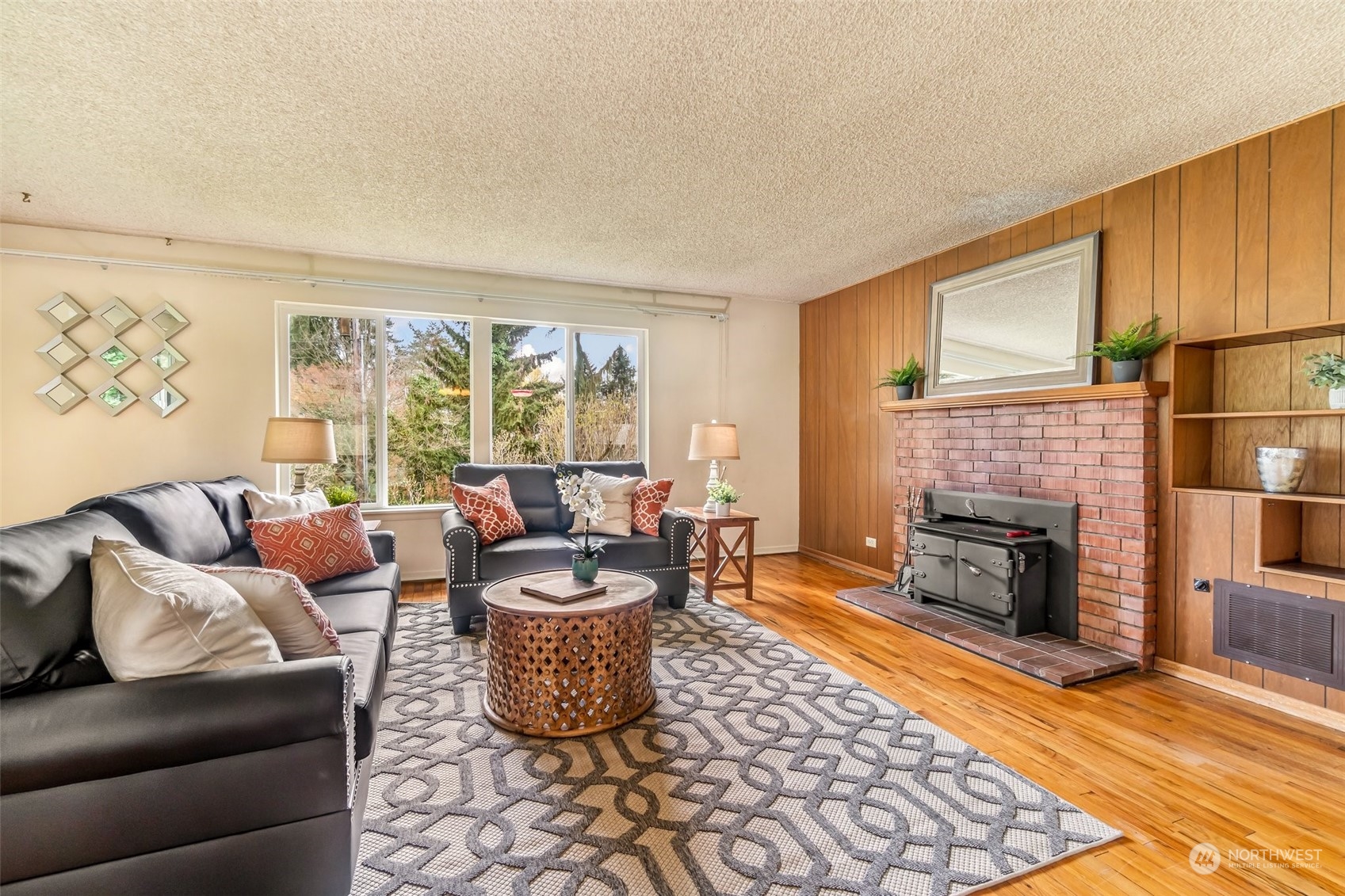 24324 7th Avenue West Bothell, WA 98021 - Photo 7 of 40 a living room with furniture fireplace and a table