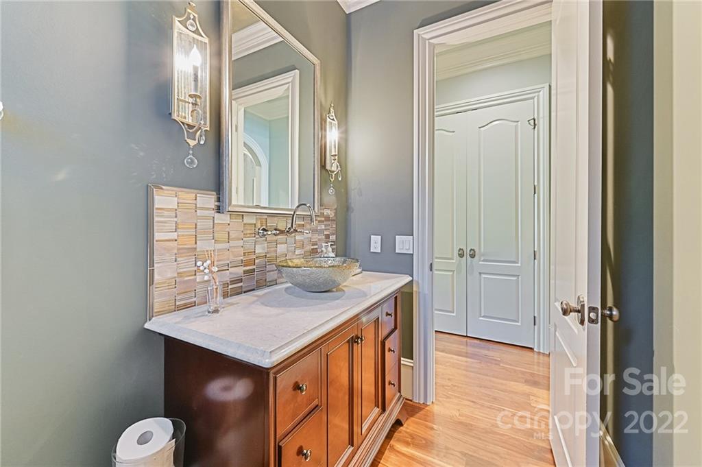 1951 Harris Road Charlotte, NC 28211 - Photo 12 of 35 a bathroom with a sink and a mirror