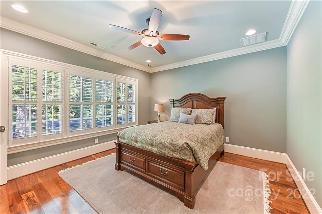 1951 Harris Road Charlotte, NC 28211 - Photo 19 of 35 a bedroom with a large bed and a large window
