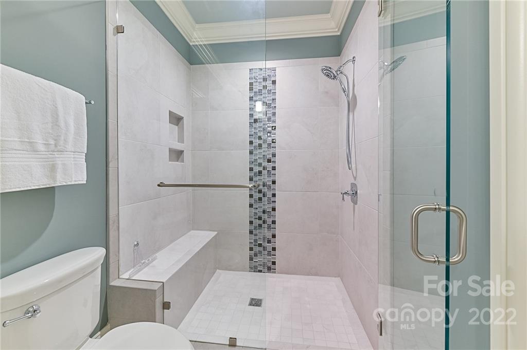 1951 Harris Road Charlotte, NC 28211 - Photo 20 of 35 a bathroom with a toilet and a shower