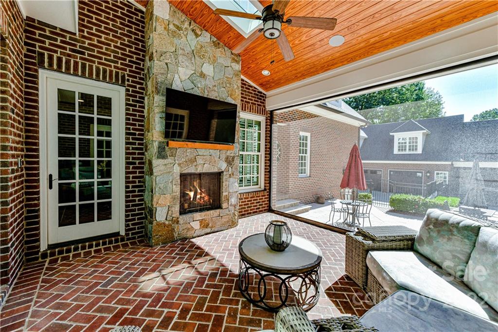 1951 Harris Road Charlotte, NC 28211 - Photo 30 of 35 a balcony with furniture and a fireplace