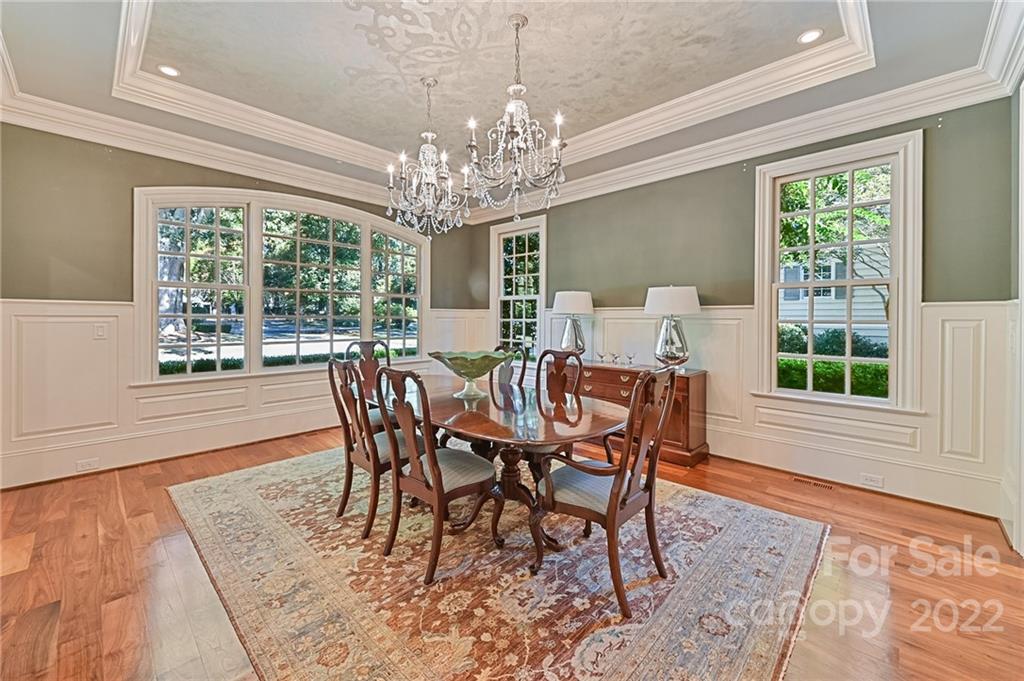 1951 Harris Road Charlotte, NC 28211 - Photo 6 of 35 a view of a dining room with furniture a chandelier and wooden floor