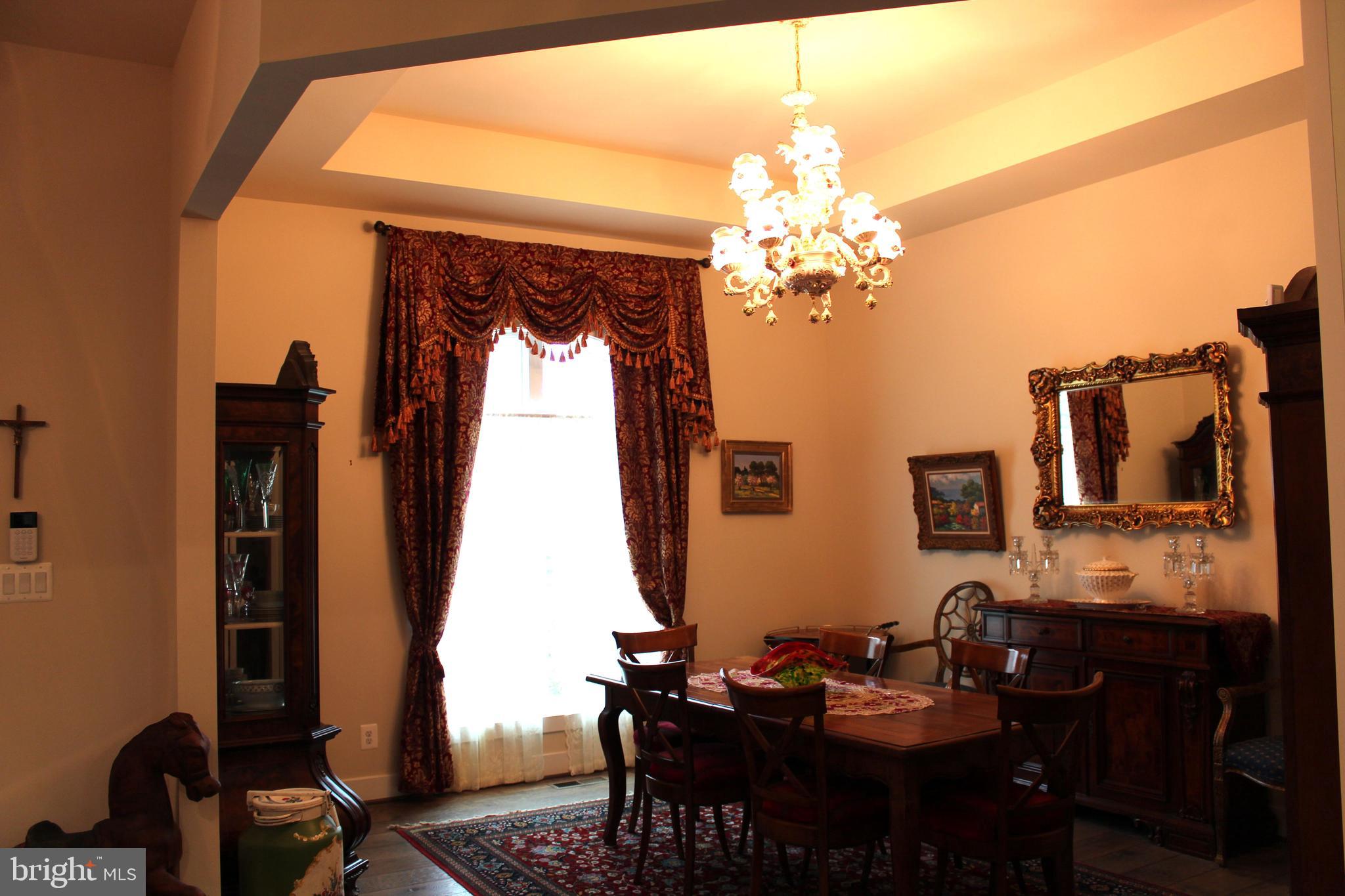 2342 Courthouse Road Stafford, VA 22554 - Photo 11 of 66 a view of a dining room with furniture and chandelier