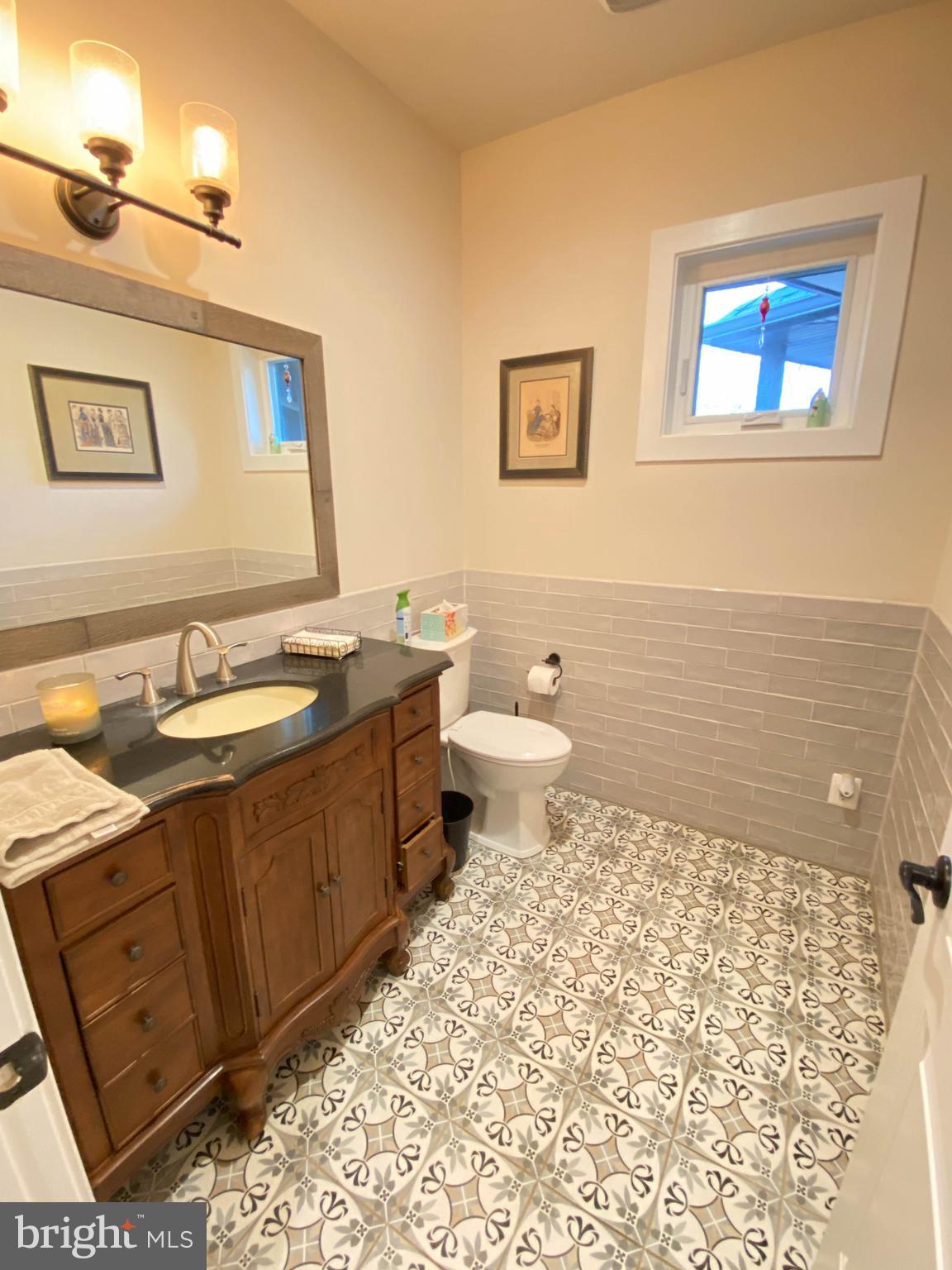 2342 Courthouse Road Stafford, VA 22554 - Photo 42 of 66 a bathroom with a sink a toilet and mirror