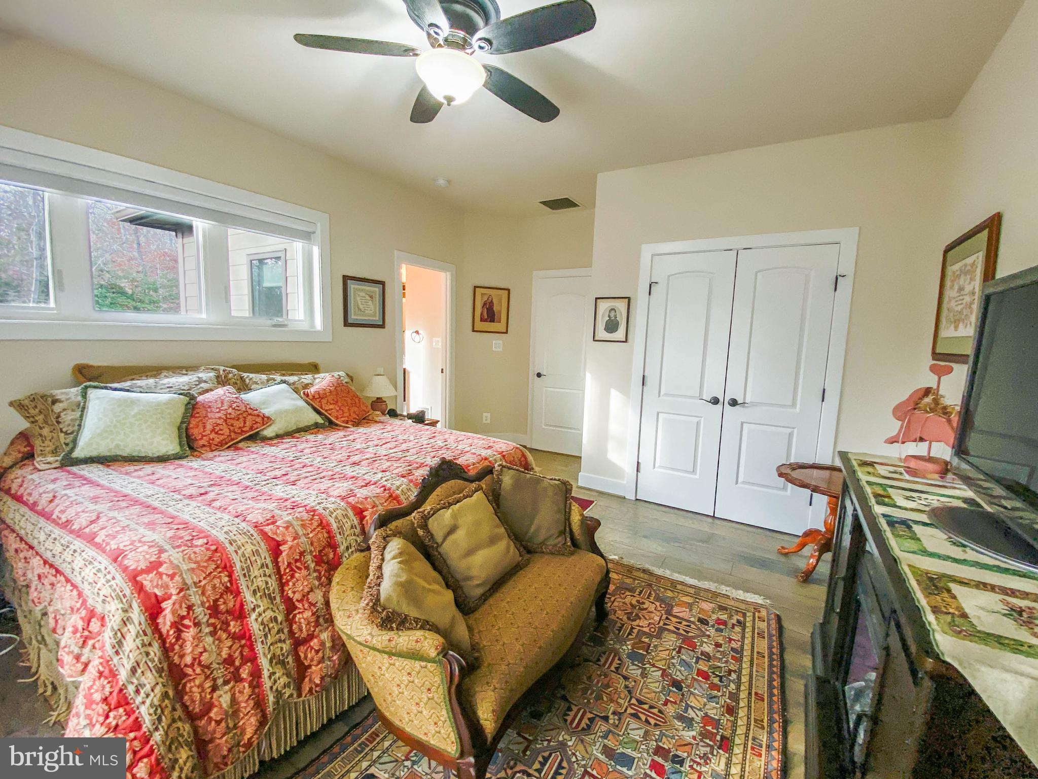 2342 Courthouse Road Stafford, VA 22554 - Photo 44 of 66 a bedroom with a bed and a flat screen tv