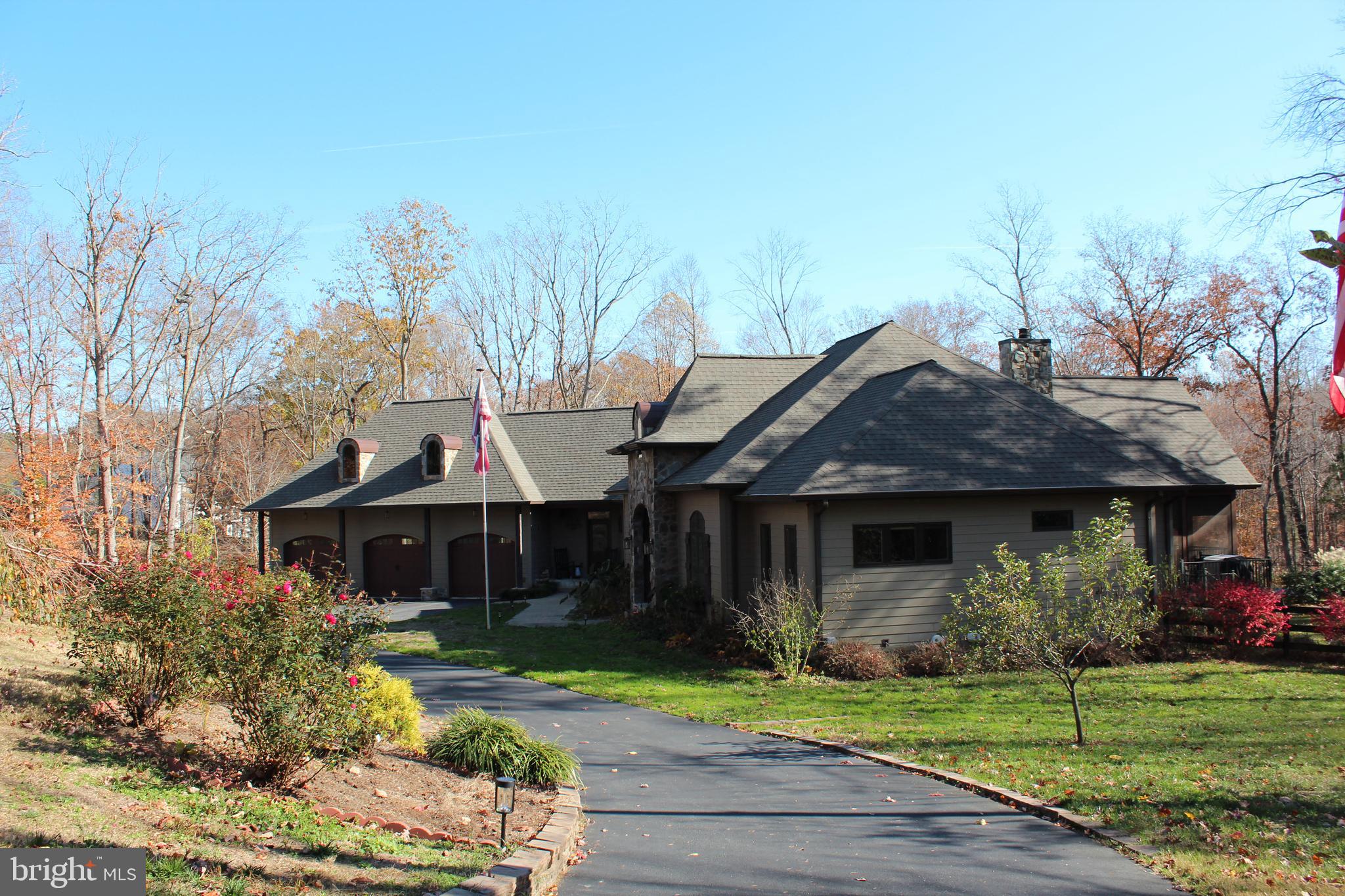 2342 Courthouse Road Stafford, VA 22554 - Photo 57 of 66 a front view of a house with a yard and potted plants