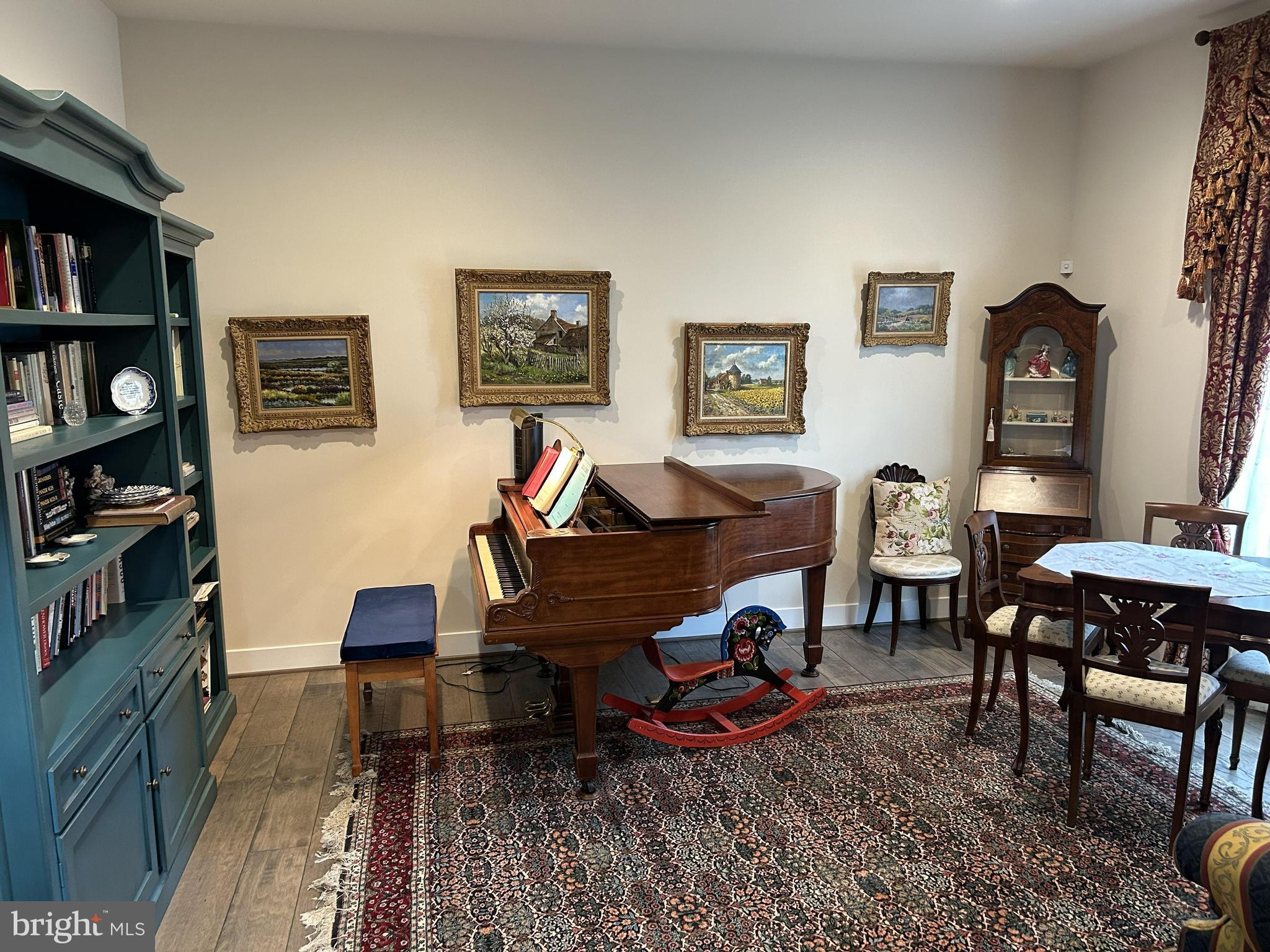 2342 Courthouse Road Stafford, VA 22554 - Photo 8 of 66 a living room with furniture a rug and a bookshelf