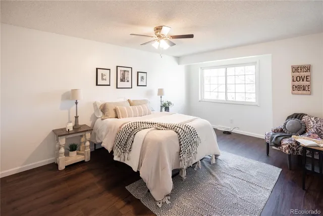 a bed room with a bed and a chandelier