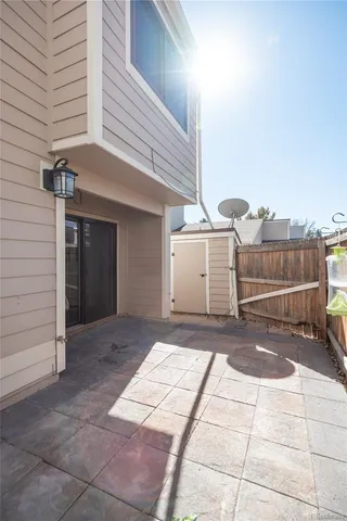 a view of a house with snow on the road