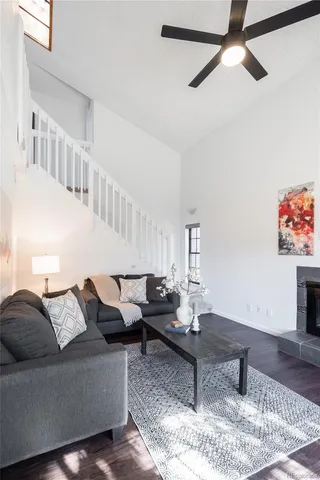 a living room with furniture and a rug