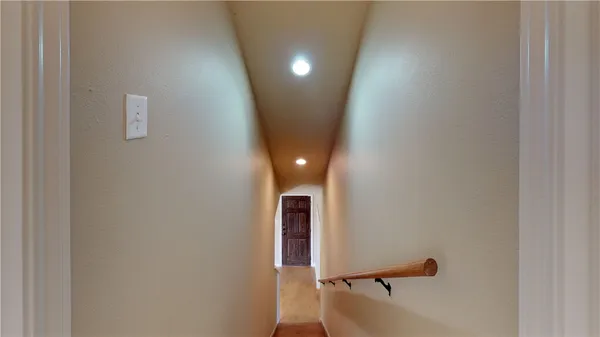a view of a room with a hallway