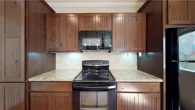 a kitchen with a stove and a microwave