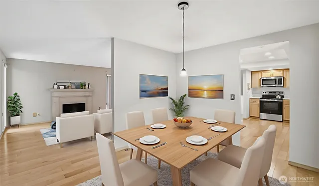 a view of a dining room with furniture window and wooden floor