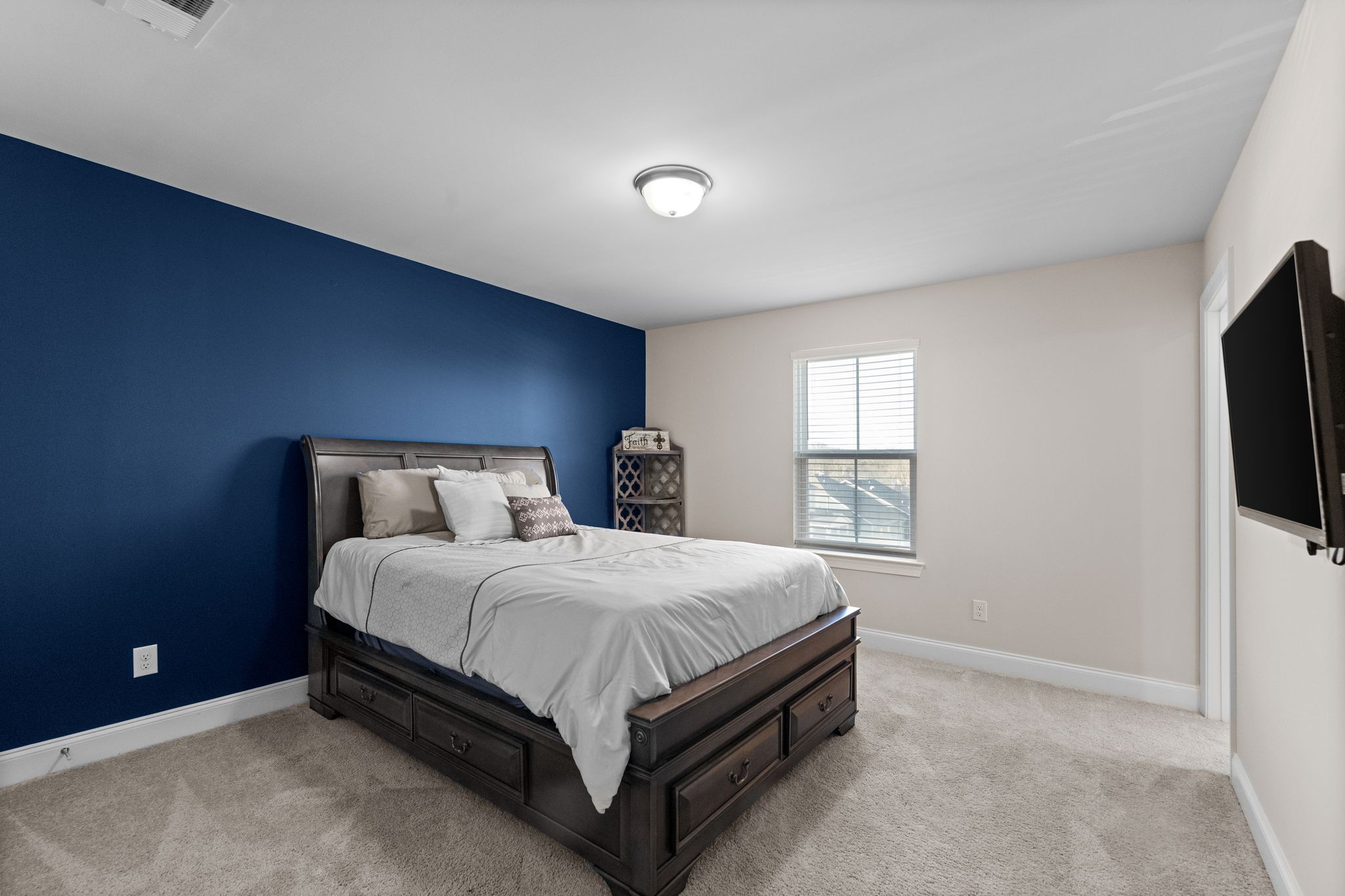 2004 Notchleaf Road Antioch, TN 37013 - Photo 13 of 19 a bedroom with a bed and a flat screen tv