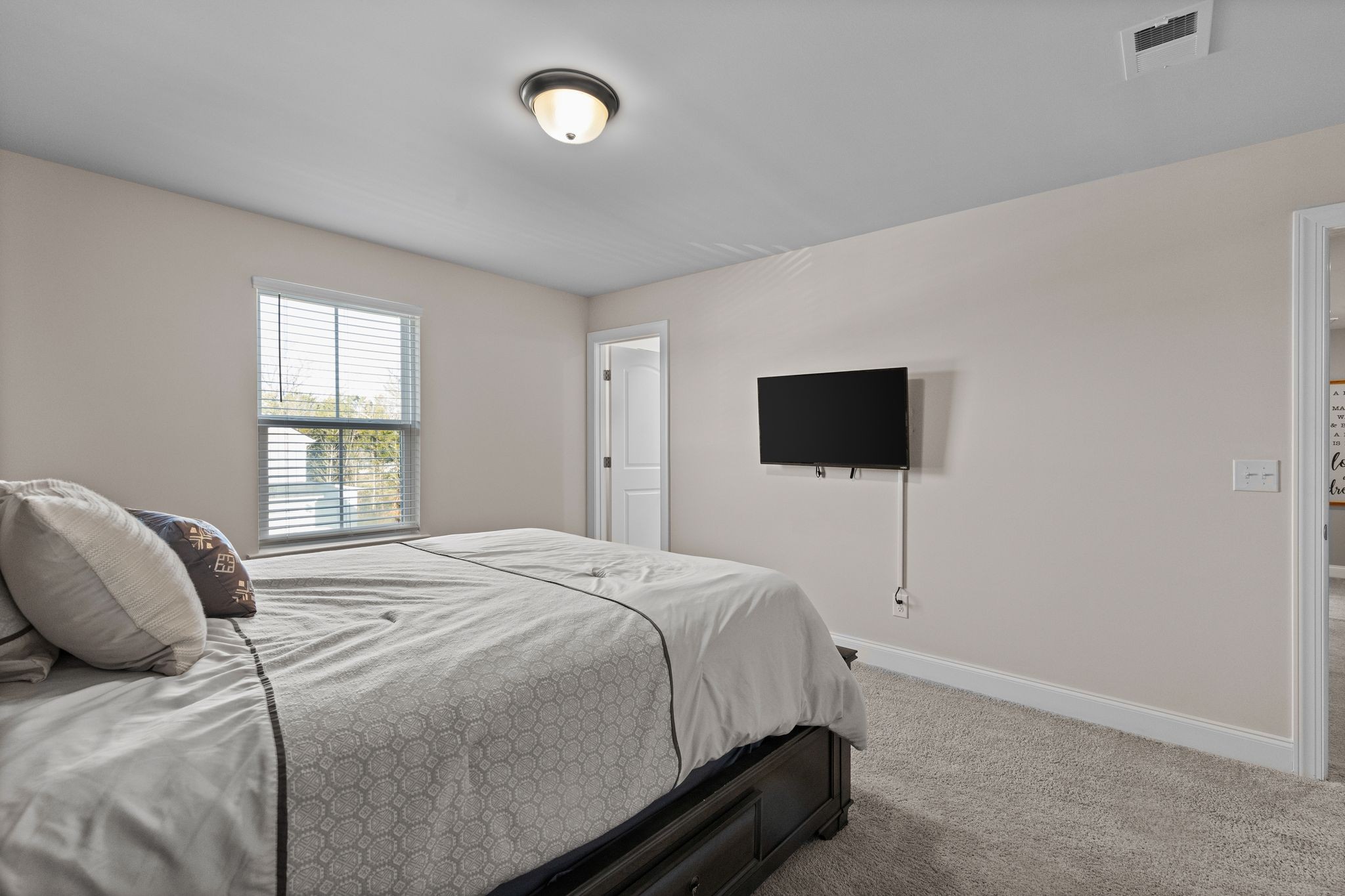 2004 Notchleaf Road Antioch, TN 37013 - Photo 14 of 19 a bedroom with a bed and a flat screen tv