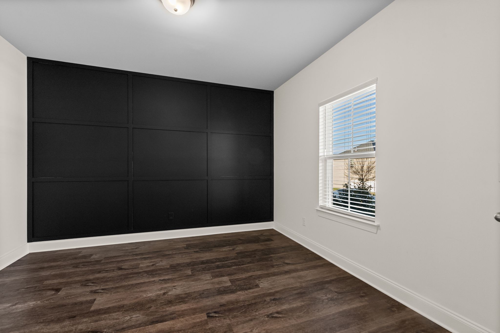 2004 Notchleaf Road Antioch, TN 37013 - Photo 3 of 19 a view of an empty room with wooden floor and a window