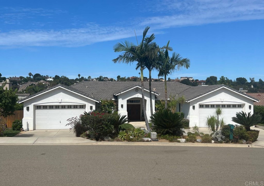 28288 Deep Canyon Drive Escondido, CA 92026 - Photo 1 of 75 a front view of a house with a yard and garage