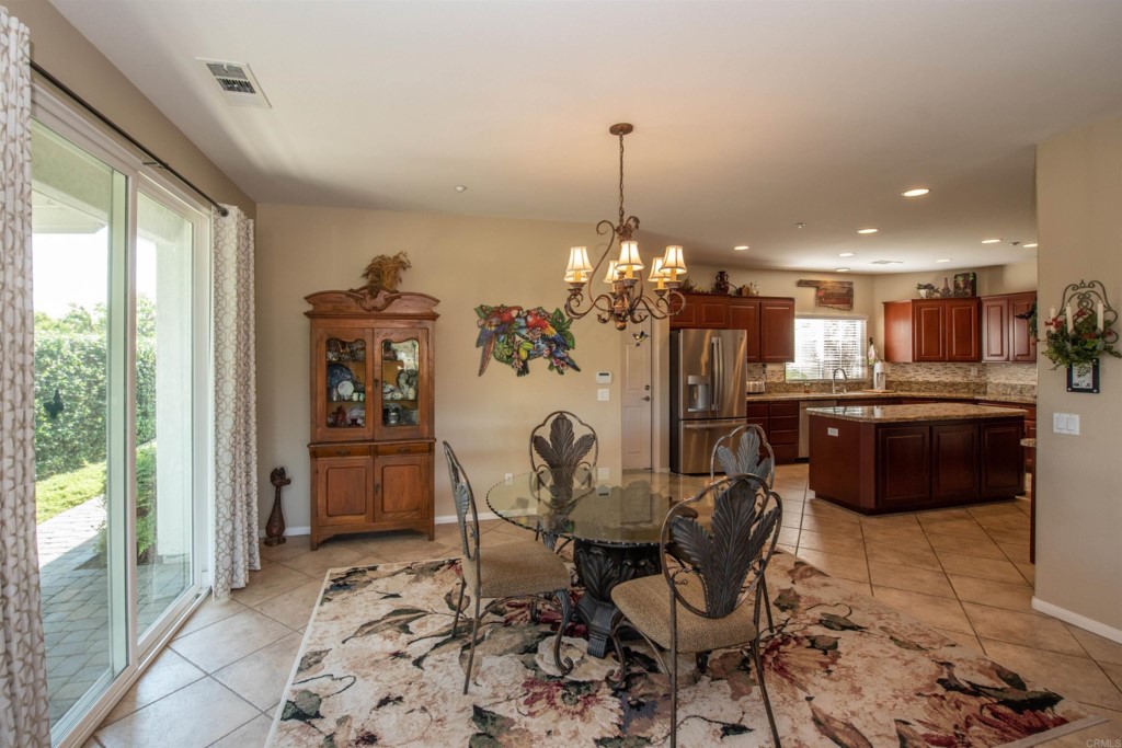 28288 Deep Canyon Drive Escondido, CA 92026 - Photo 15 of 75 a view of a dining room with furniture window and outside view