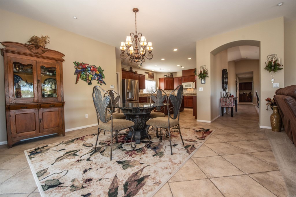 28288 Deep Canyon Drive Escondido, CA 92026 - Photo 27 of 75 a view of a dining room with furniture and chandelier