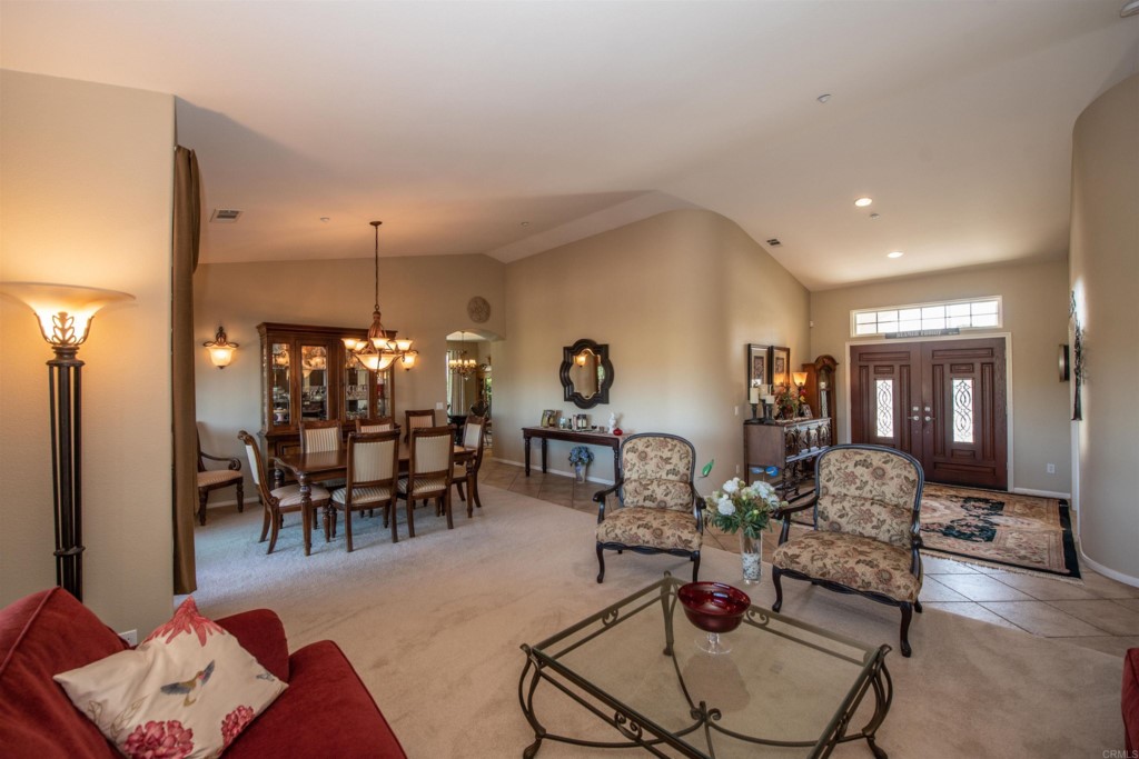 28288 Deep Canyon Drive Escondido, CA 92026 - Photo 31 of 75 a living room with furniture and a chandelier