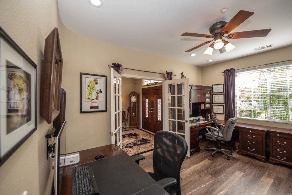 28288 Deep Canyon Drive Escondido, CA 92026 - Photo 40 of 75 a view of a livingroom with workspace and windows
