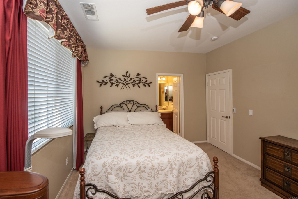 28288 Deep Canyon Drive Escondido, CA 92026 - Photo 49 of 75 a bedroom with a bed and wooden floor