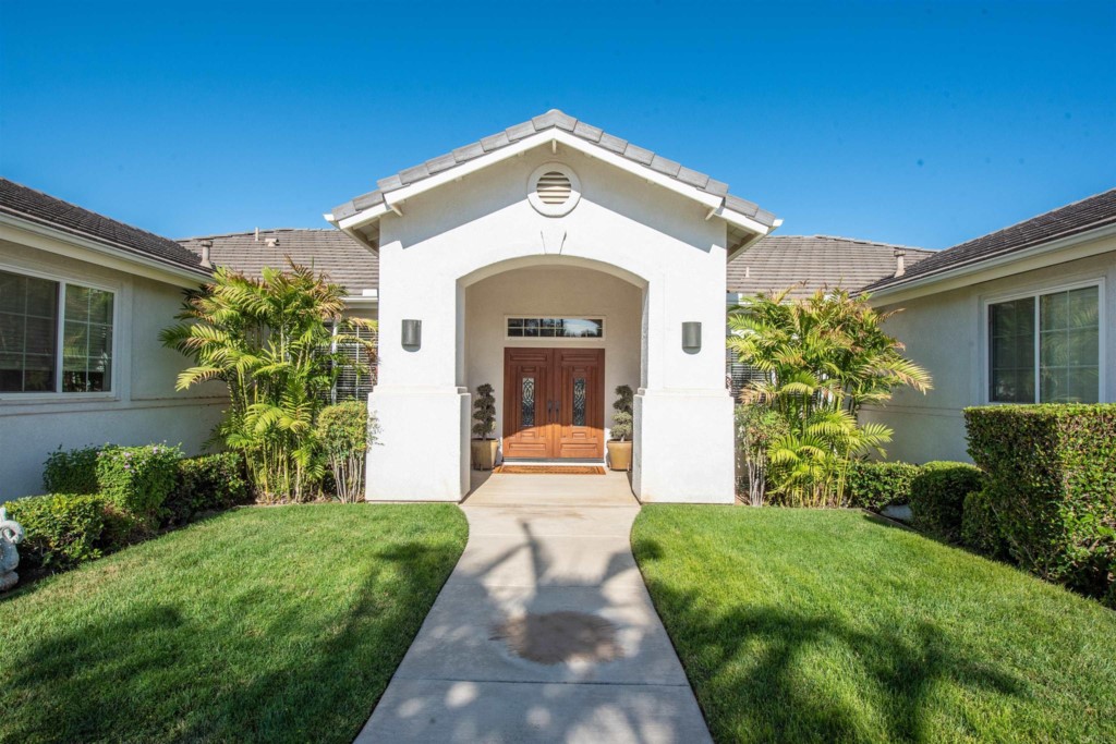 28288 Deep Canyon Drive Escondido, CA 92026 - Photo 5 of 75 a front view of a house with garden