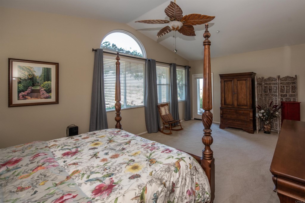 28288 Deep Canyon Drive Escondido, CA 92026 - Photo 55 of 75 a bedroom with bed and a chandelier