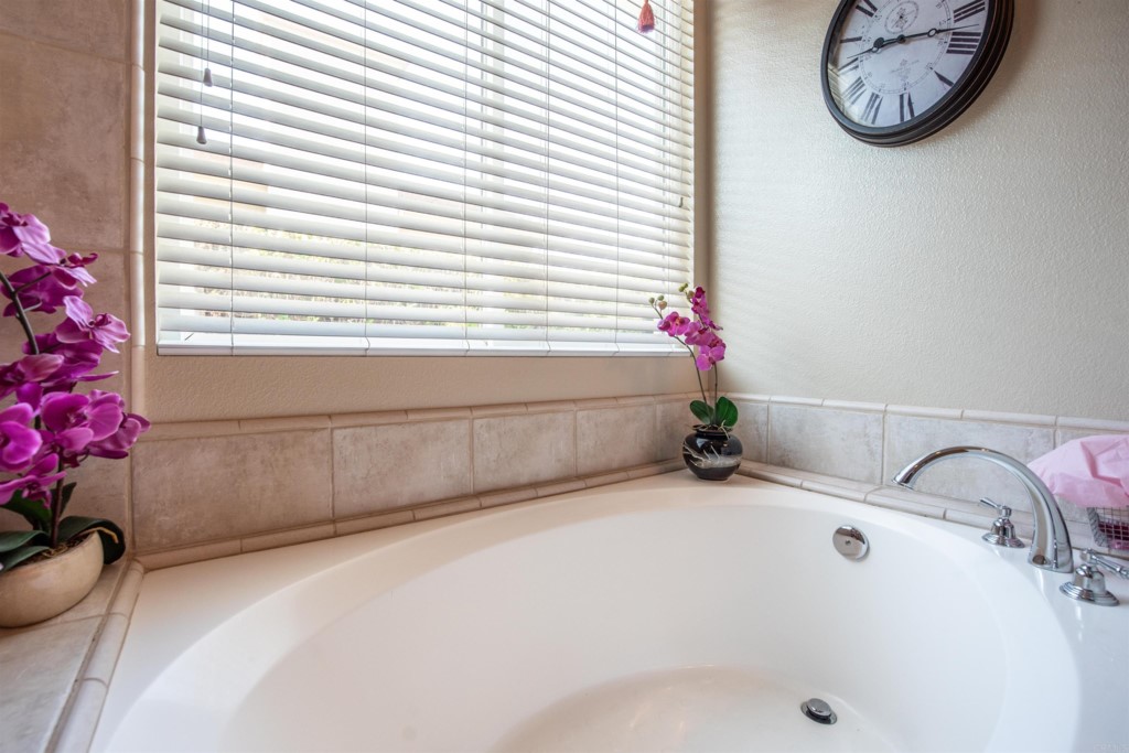 28288 Deep Canyon Drive Escondido, CA 92026 - Photo 59 of 75 a bathroom with a tub and a window