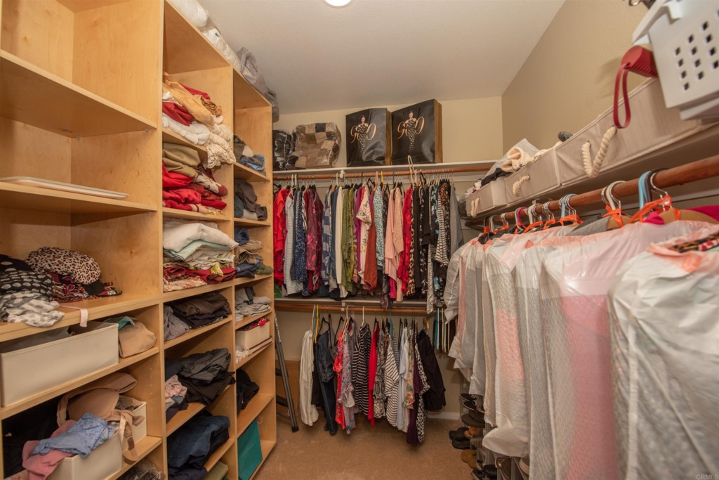 28288 Deep Canyon Drive Escondido, CA 92026 - Photo 63 of 75 a view of walk in closet with clothes and shoes